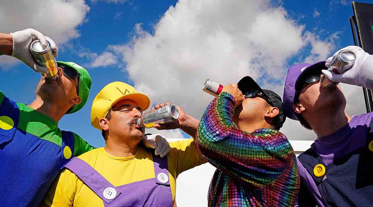 Fans drink beer watching the 10th hole during the third round at the WM Phoenix Open at TPC Scottsdale.